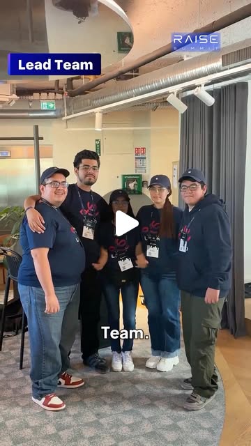 Poster frame of the RAISE Summit Reel: five people in navy team shirts and lanyards standing together indoors, with the on-screen label Lead Team, the RAISE Summit logo, and a play button